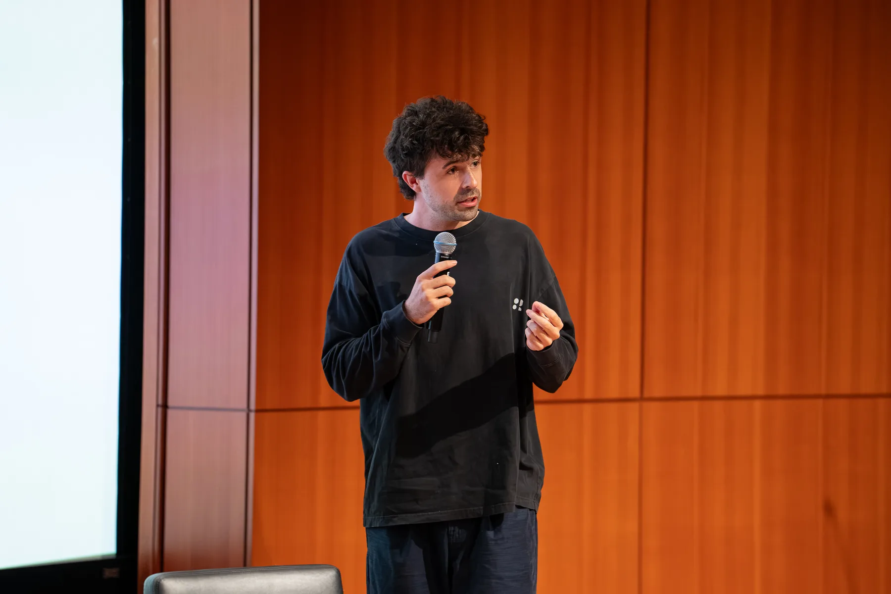 Liam Bolling speaking on stage at Google